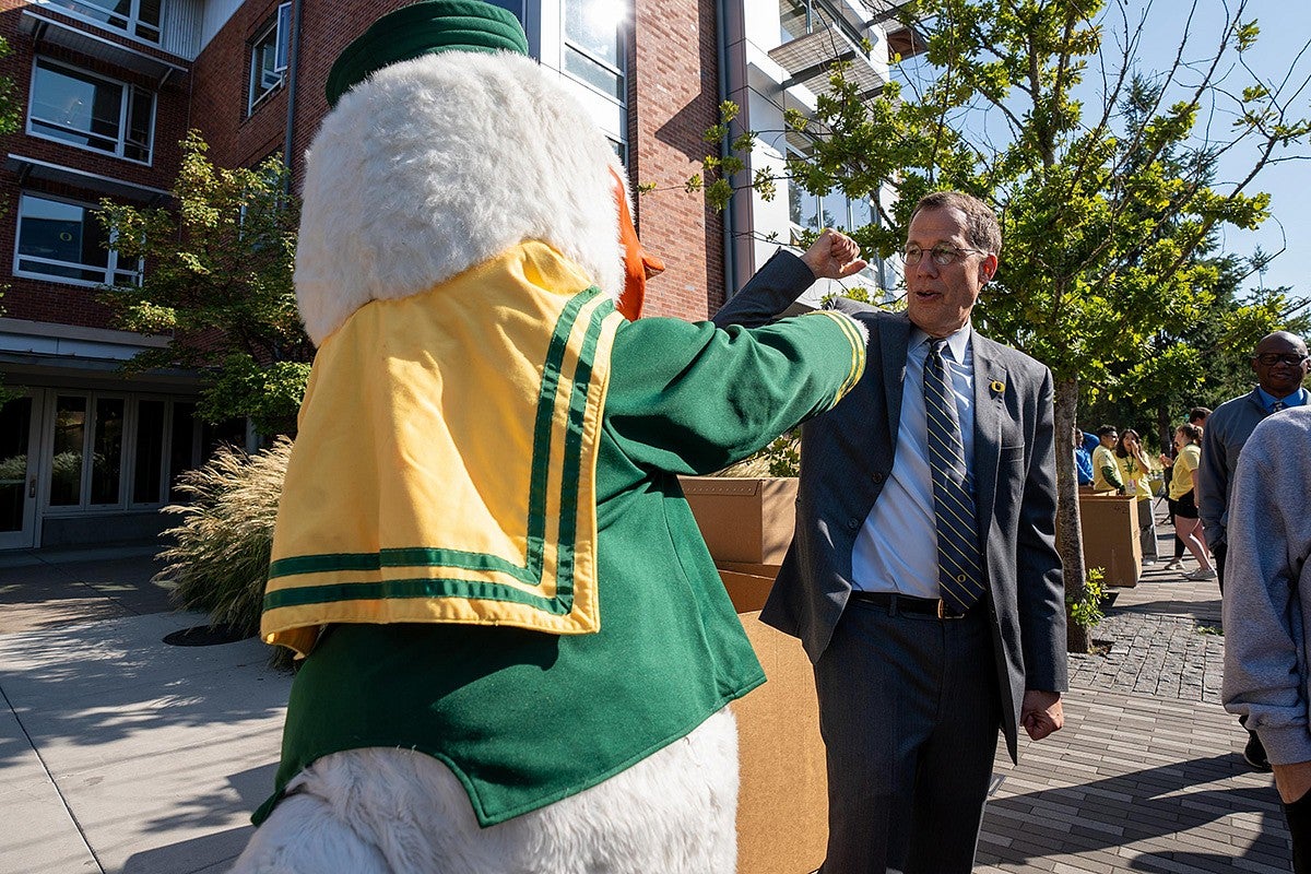 President Scholz giving the Oregon Duck a fist bump