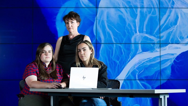 Professor Amy Lobben with geography alumna Josie Imrie and geography major Arielle Alferez