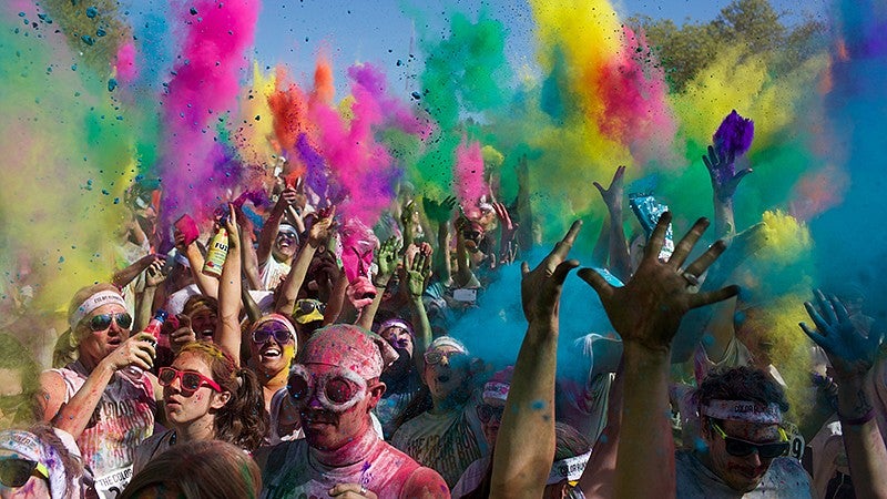 Crowd and colorful powder in the air