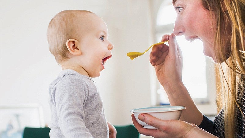 Adult feeding infant