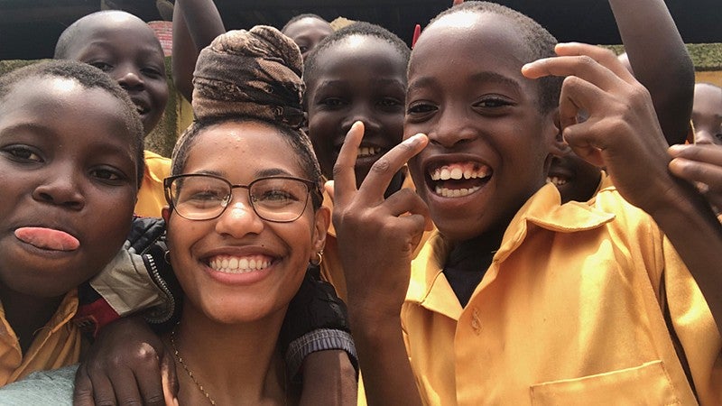 Joan Hicks with children in Ghana