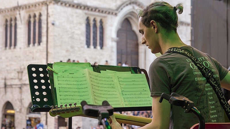 UO student performing guitar on stage