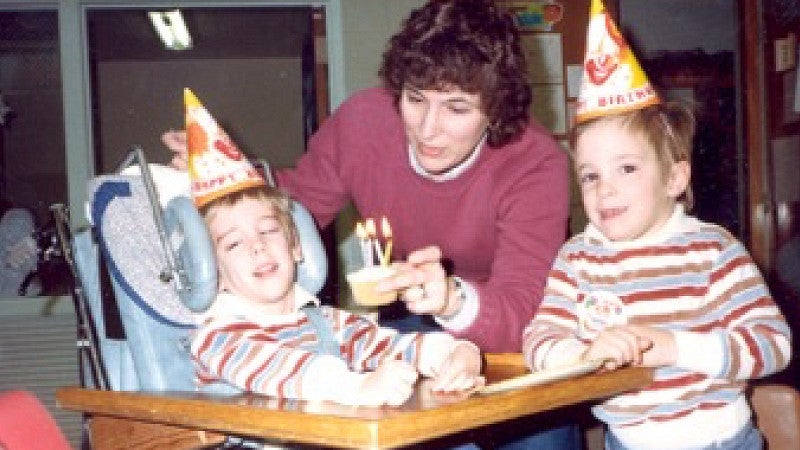 Brian Trapp, as child, with his brother, Danny, in a wheelchair, for a birthday party