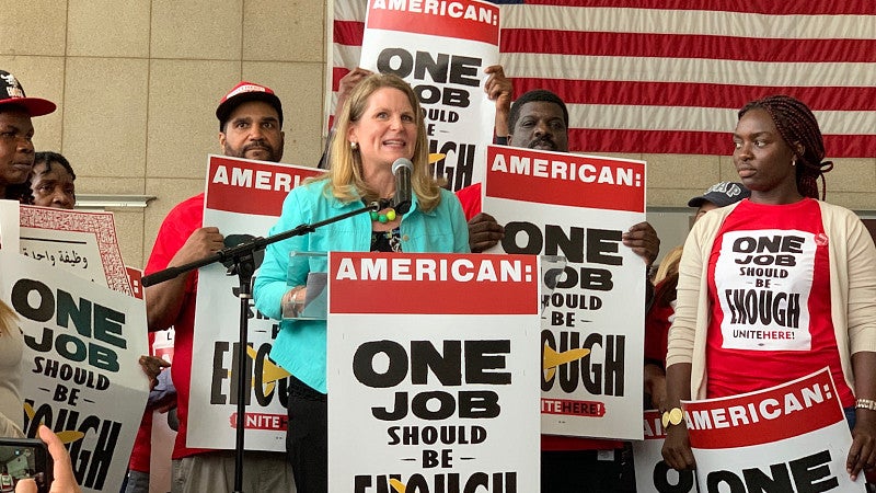 Liz Shuler at podium speaking for an AFL-CIO rally