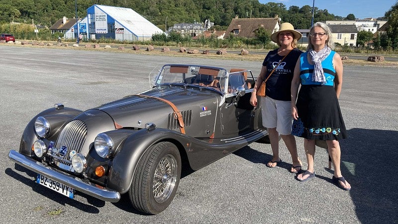 Jane Lake and friend with a vintage car