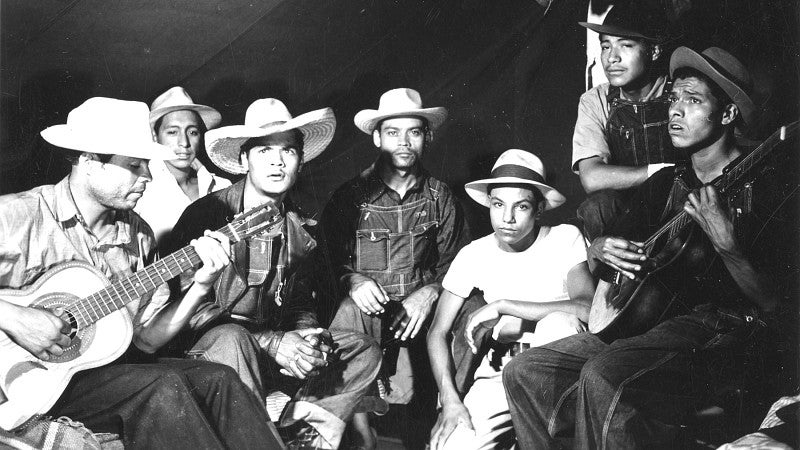 Workers playing guitars. Courtesy of the Extension Bulletin Illustrations Photograph Collection (P 020), Oregon State University Special Collections and Archives Research Center, Corvallis, Oregon.