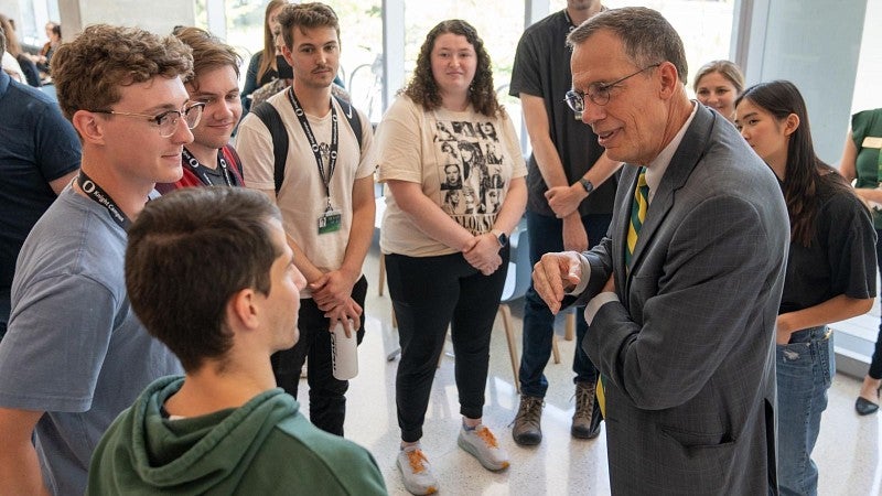 President Scholz meets with a handful of students in the Knight Campus