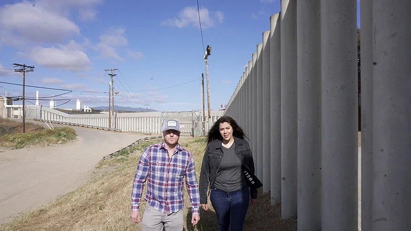 Adam Markle with Jessica Solis on the US-Mexico border