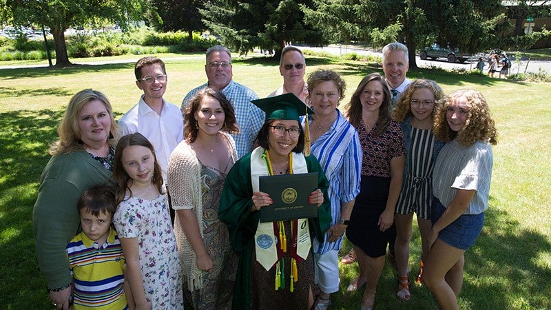 Zoë Haakenstaad celebrating UO commencement with group