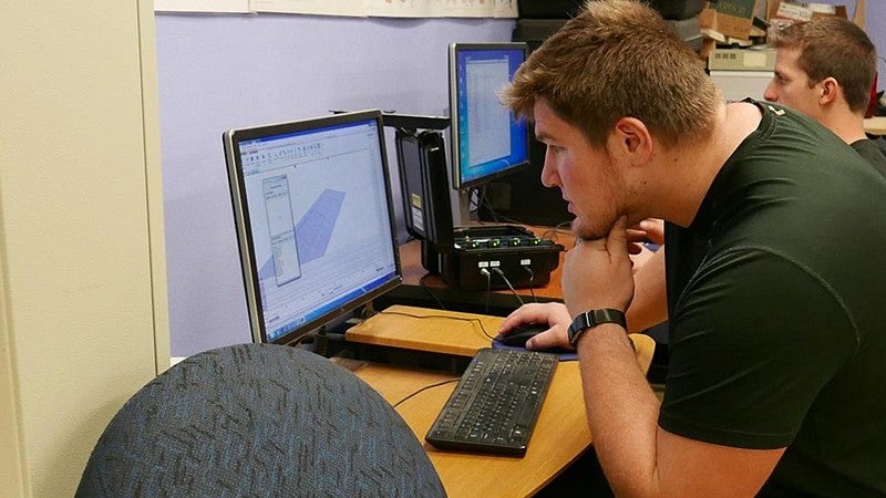 Calvin Throckmorton working at a computer
