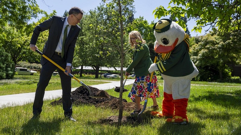 Karl Scholz Melissa Scholz and Duck plant the 2024 investiture tree