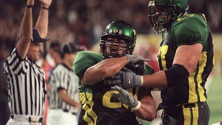 A Ducks footballer celebrates a touchdown