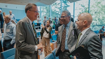 President Scholz meeting people at the Knight Campus