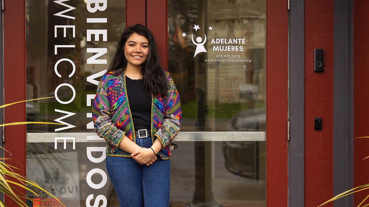 Itzel Chavez Gomez in front of the Adelante Mujeres office