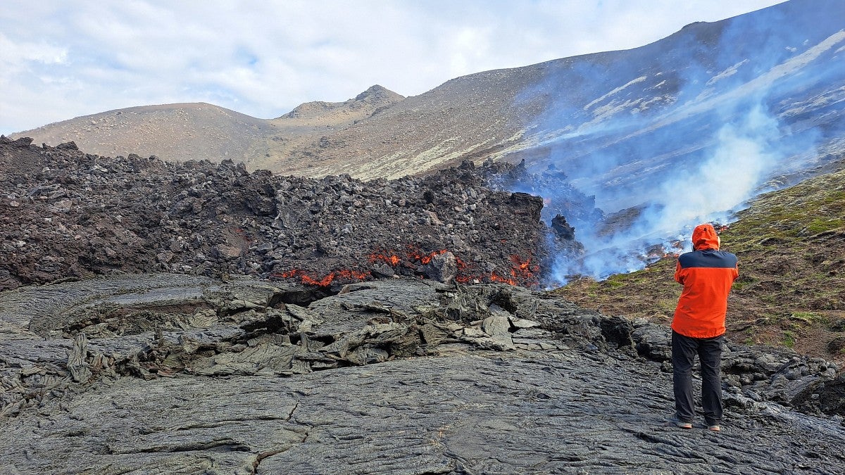 scientist examines magma flow