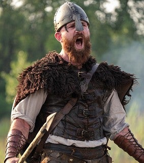 Thorfinn, in full battle gear, releases a Viking yell