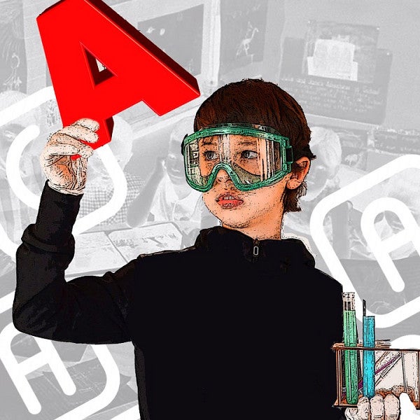 Child in work goggles examining letter "A" to suggest literacy and testing