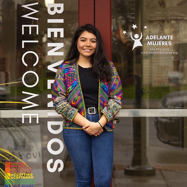 Itzel Chavez Gomez in front of the Adelante Mujeres office