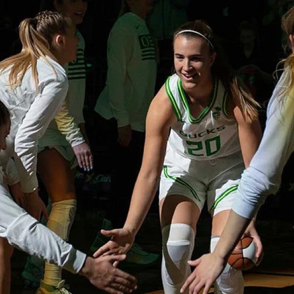 Sabrina Ionescu celebrates with teammates